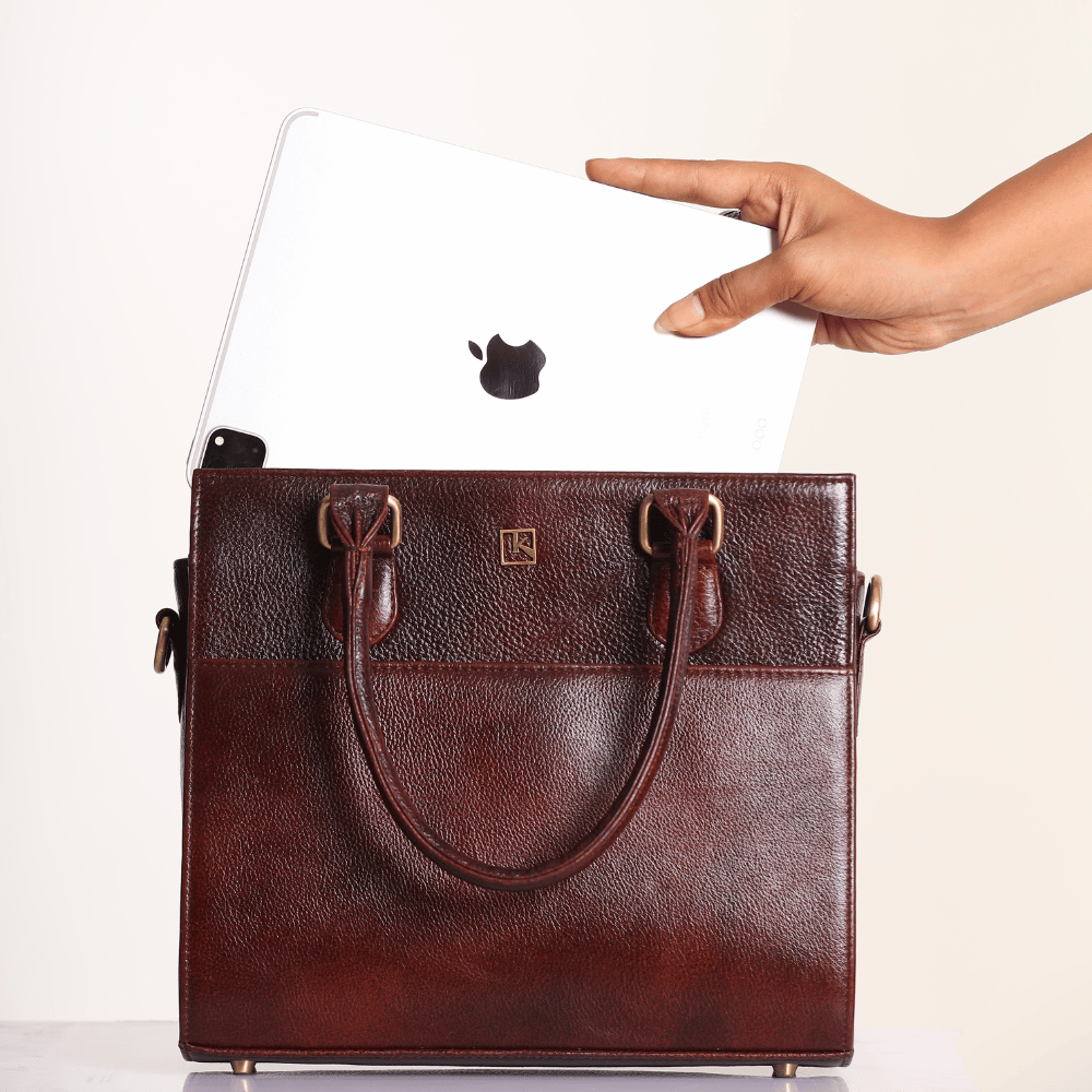 A close up shot of MIVA Wine Maroon bag showing it fits ipad and all your daily necessary items.